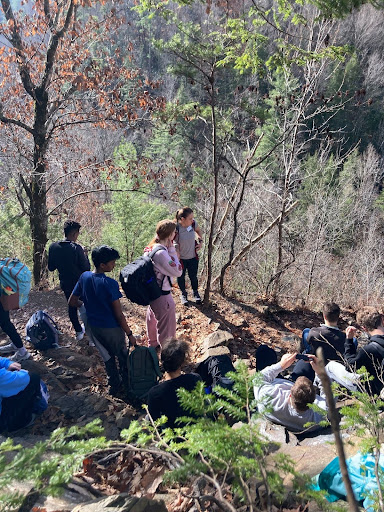 Instructor Grayson teaching Group B about the types of rocks found on the mountainsides.